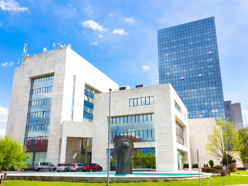 modern-medical-office-building-exterior Modern medical office building with glass and stone exterior under a blue sky