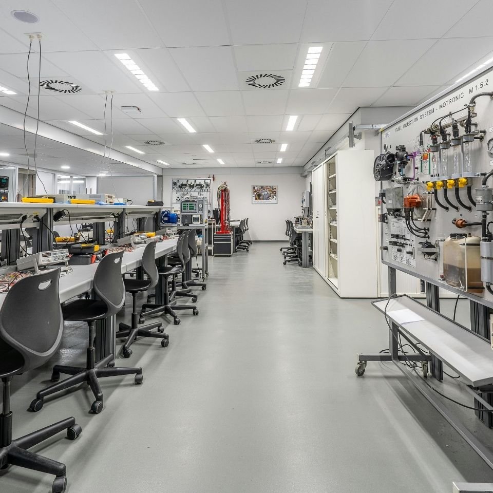 STEM classroom with lab benches, tools, and electronics equipment in a bright instructional space